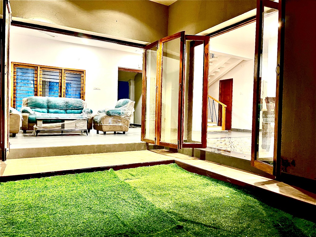 Beautiful living area with natural light and garden view